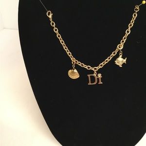 Diamonds International 7” charm bracelet with added shell and fish charms